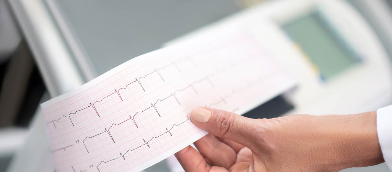 close-up-of-doctors-hand-with-electrocardigram-res