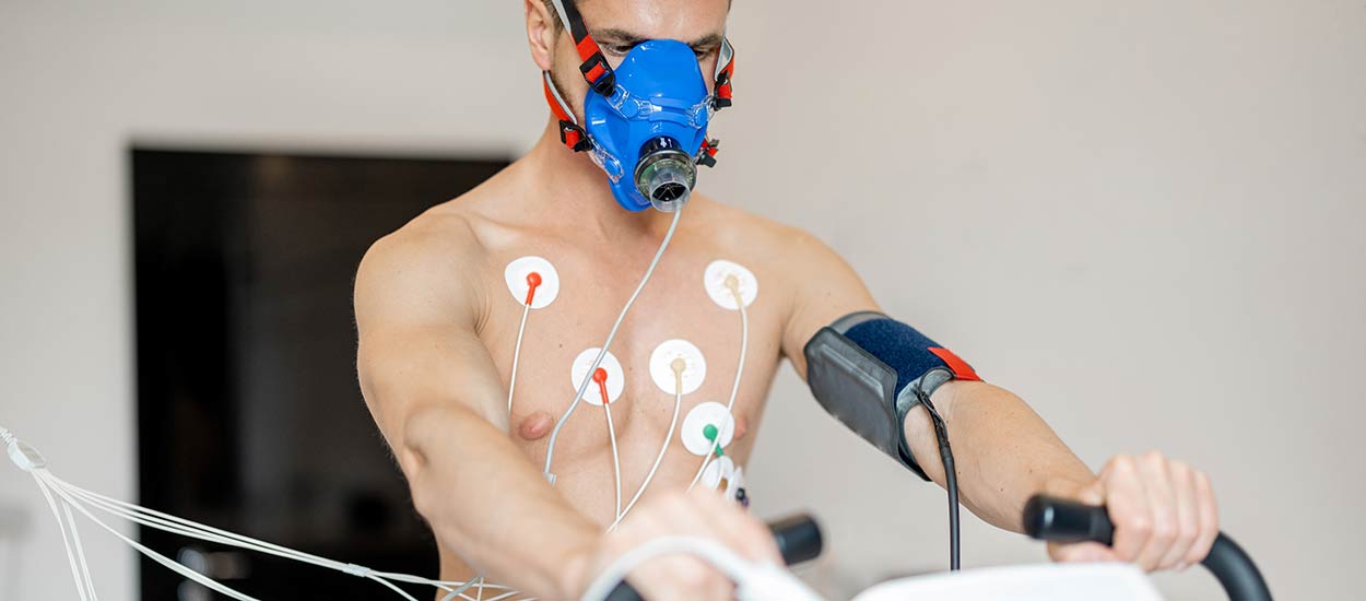 man-examining-his-cardiovascular-system-on-bike